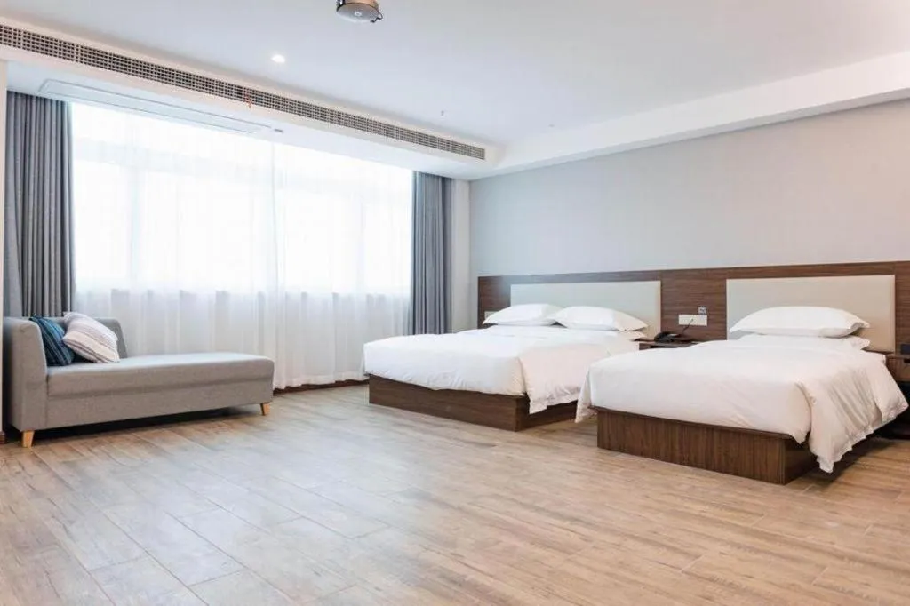 Bed in Borrman Hotel East Huai'an Railway Station Zhou 'Enlai Memorial