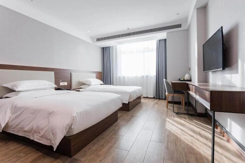 Bed in Borrman Hotel East Huai'an Railway Station Zhou 'Enlai Memorial