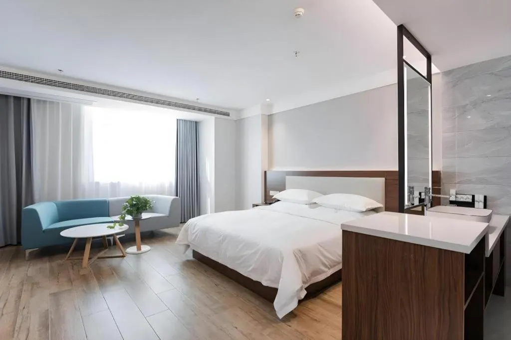 Bed in Borrman Hotel East Huai'an Railway Station Zhou 'Enlai Memorial