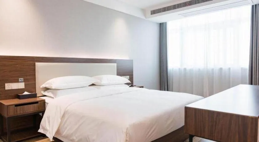 Bed in Borrman Hotel East Huai'an Railway Station Zhou 'Enlai Memorial