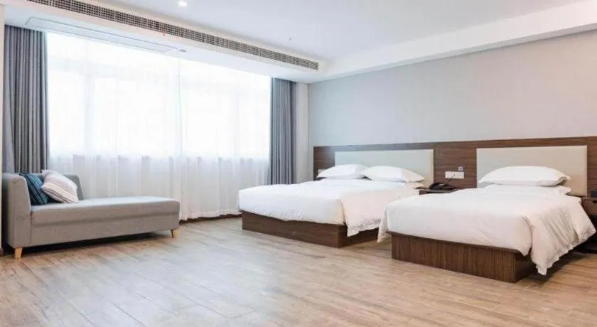 Bed in Borrman Hotel East Huai'an Railway Station Zhou 'Enlai Memorial