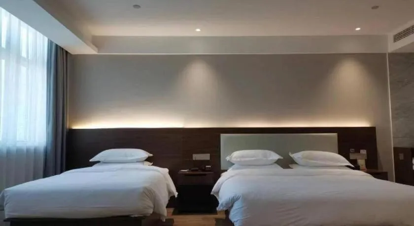 Bed in Borrman Hotel East Huai'an Railway Station Zhou 'Enlai Memorial