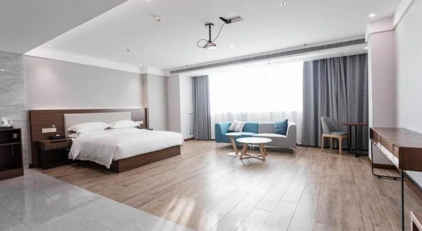 Bed in Borrman Hotel East Huai'an Railway Station Zhou 'Enlai Memorial