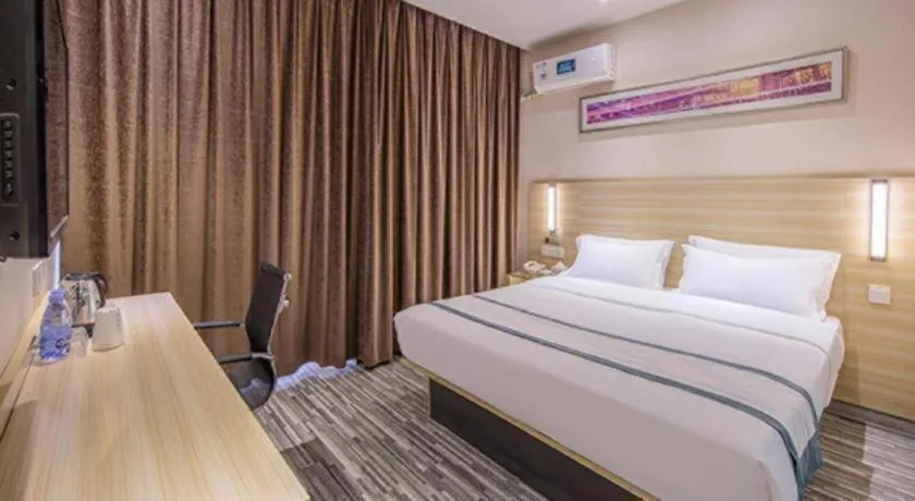 Bed in JTOUR Inn Wuzhou Arcade City Sanzongfu