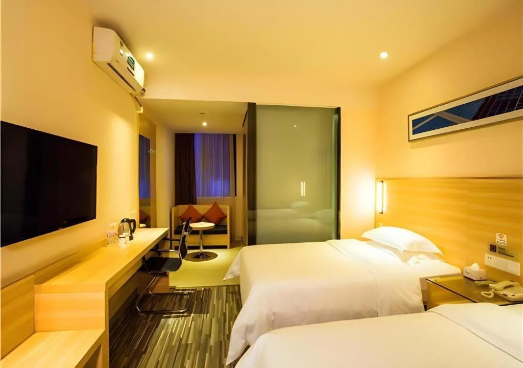 Bed in JTOUR Inn Wuzhou Arcade City Sanzongfu