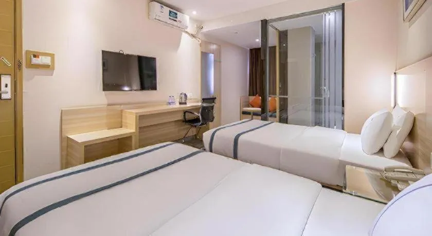 Bed in JTOUR Inn Wuzhou Arcade City Sanzongfu