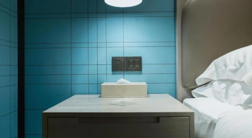 Bed in Echarm Hotel Jianshui Gucheng