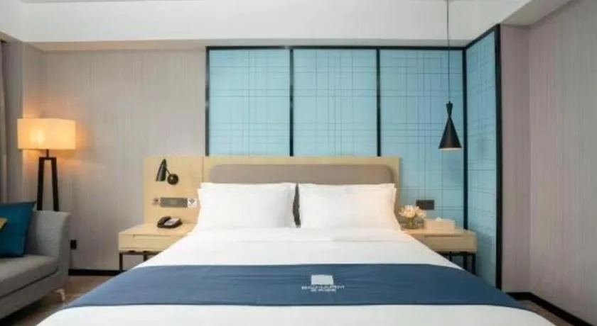 Bed in Echarm Hotel Jianshui Gucheng