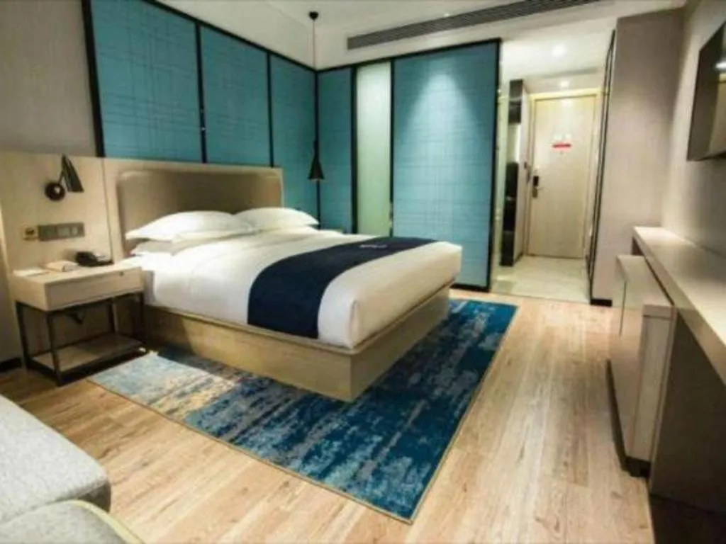 Bed in Echarm Hotel Jianshui Gucheng