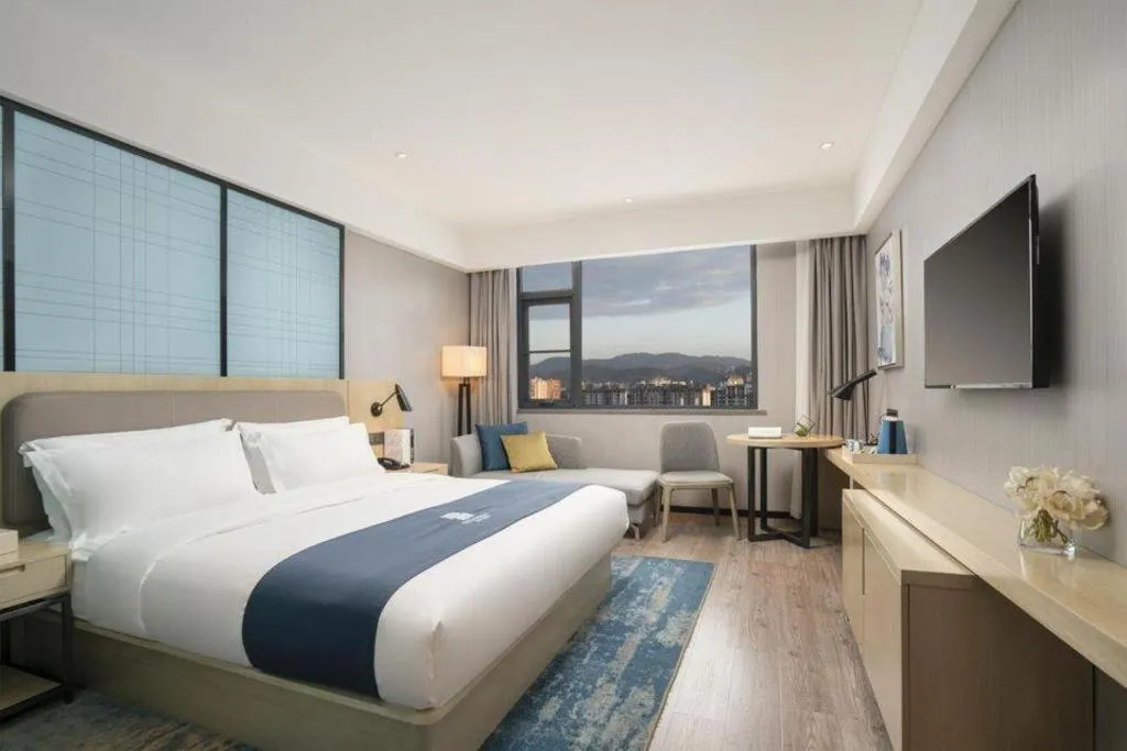 Bed in Echarm Hotel Jianshui Gucheng