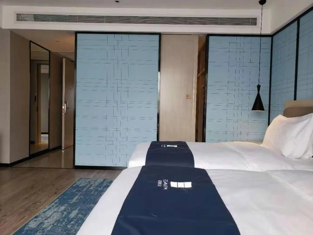 Bed in Echarm Hotel Jianshui Gucheng