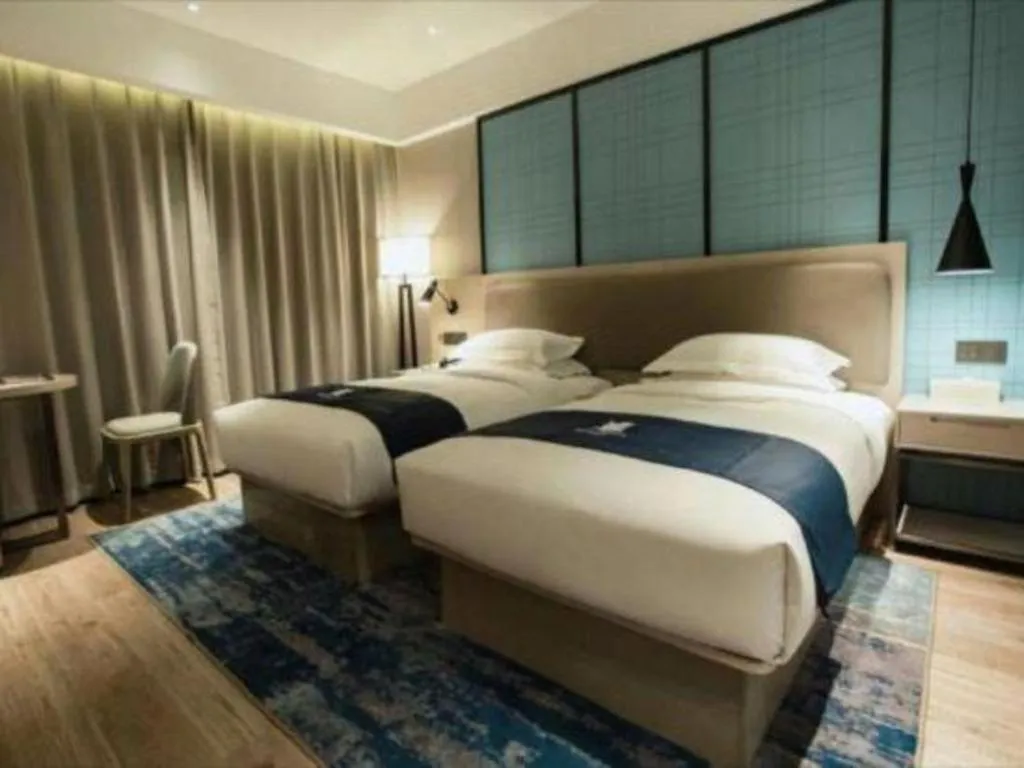 Bed in Echarm Hotel Jianshui Gucheng