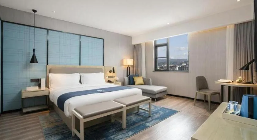 Bed in Echarm Hotel Jianshui Gucheng