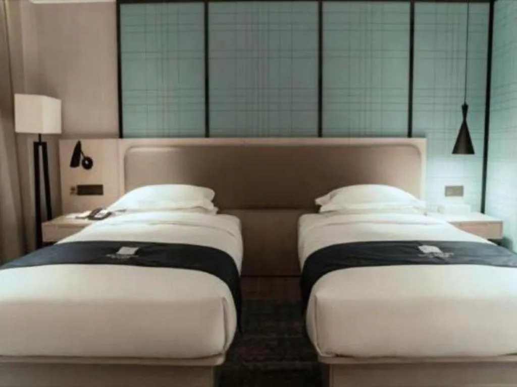 Bed in Echarm Hotel Jianshui Gucheng