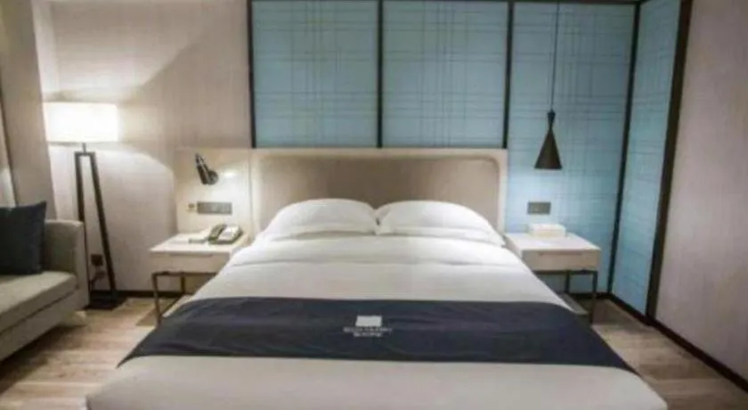 Bed in Echarm Hotel Jianshui Gucheng