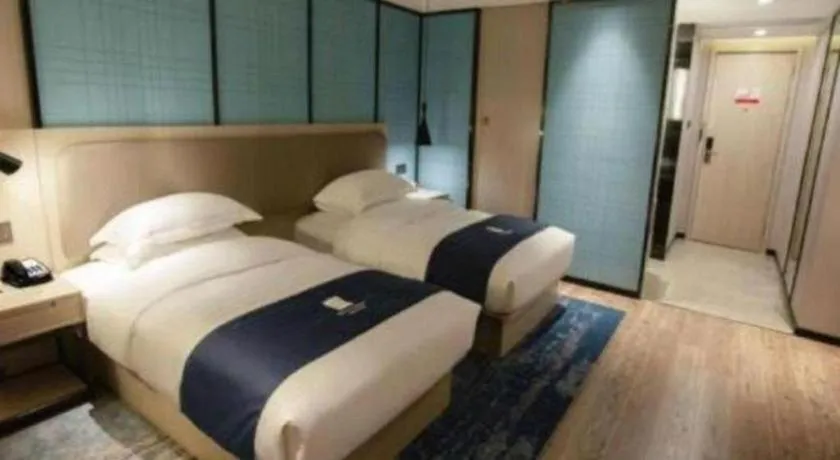 Bed in Echarm Hotel Jianshui Gucheng