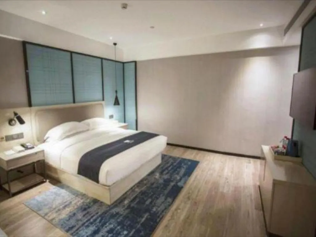 Bed in Echarm Hotel Jianshui Gucheng