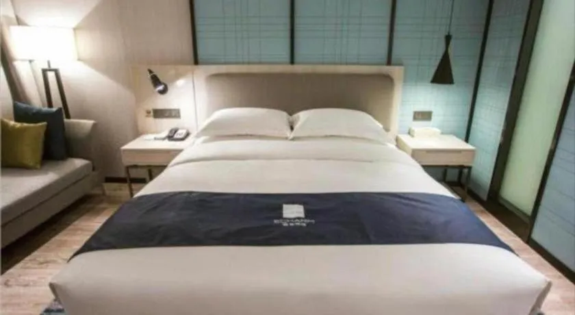 Bed in Echarm Hotel Jianshui Gucheng