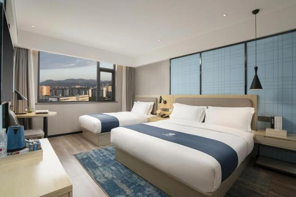 Bed in Echarm Hotel Jianshui Gucheng