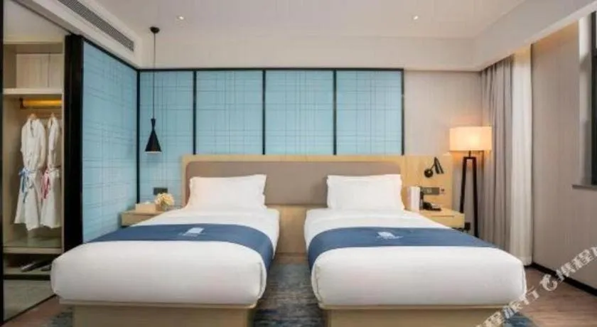 Bed in Echarm Hotel Jianshui Gucheng