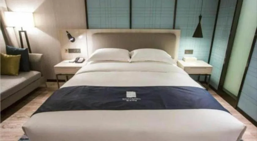 Bed in Echarm Hotel Jianshui Gucheng