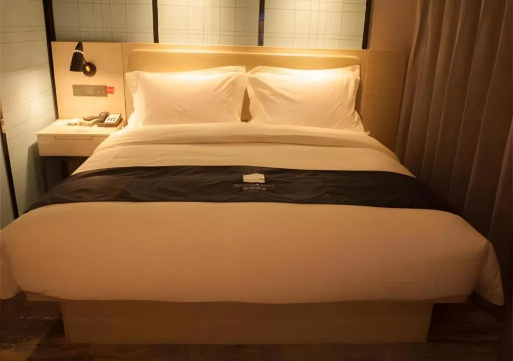 Bed in Echarm Hotel Binzhou Boxing Yinzuo