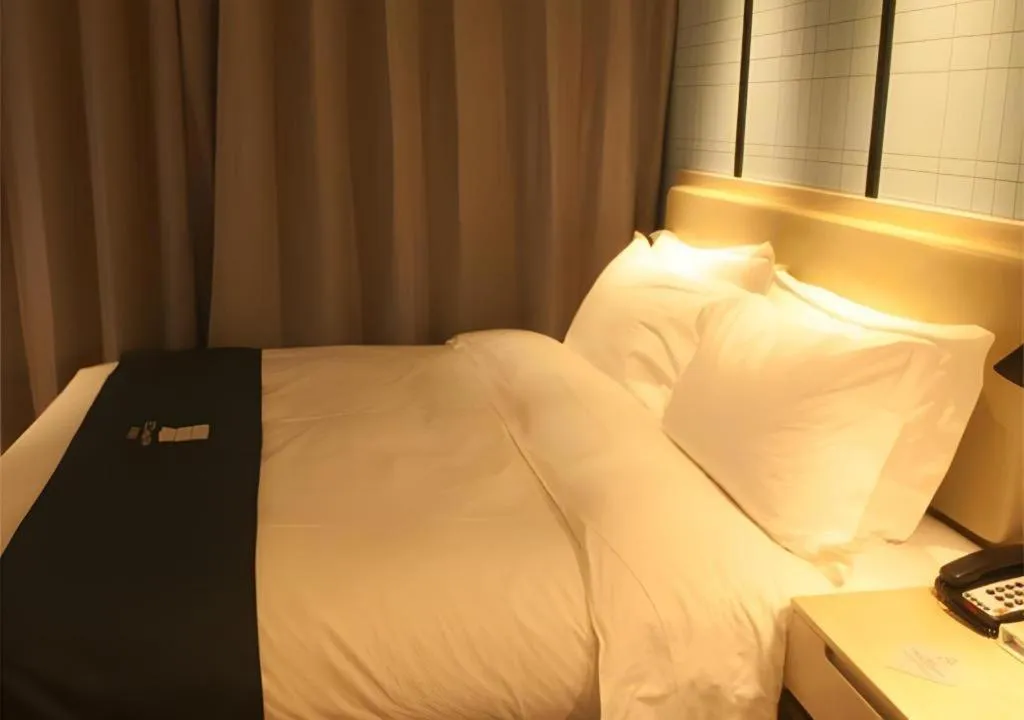 Bed in Echarm Hotel Binzhou Boxing Yinzuo