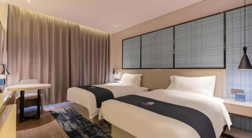 Bed in Echarm Hotel Binzhou Boxing Yinzuo