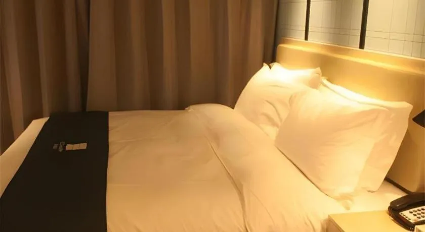 Bed in Echarm Hotel Binzhou Boxing Yinzuo