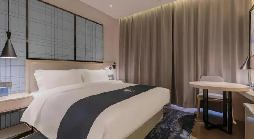 Bed in Echarm Hotel Binzhou Boxing Yinzuo