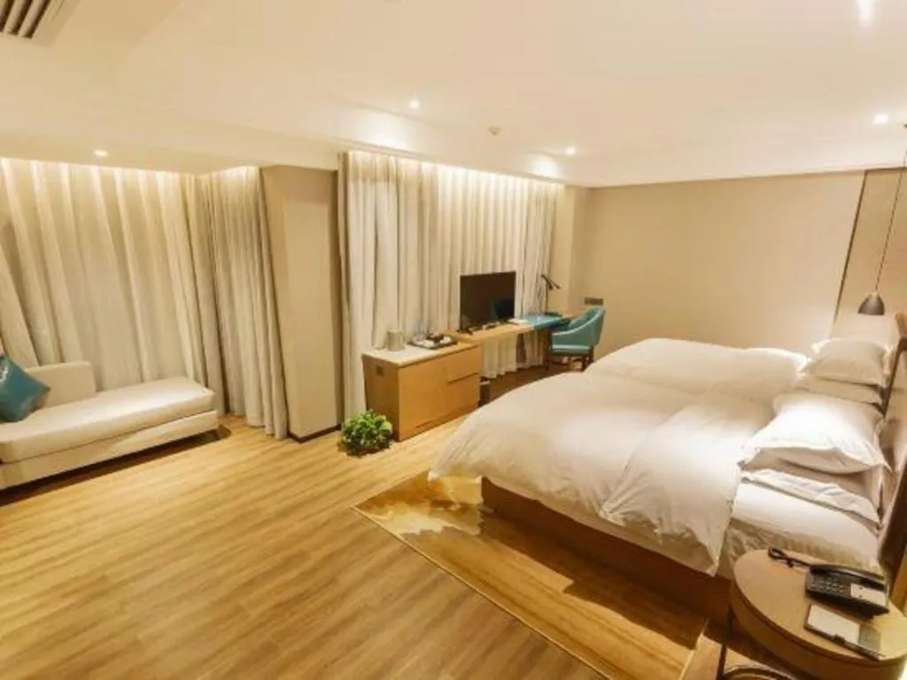 Bed in Borrman Hotel Liuzhou Guizhong Avenue Liugao