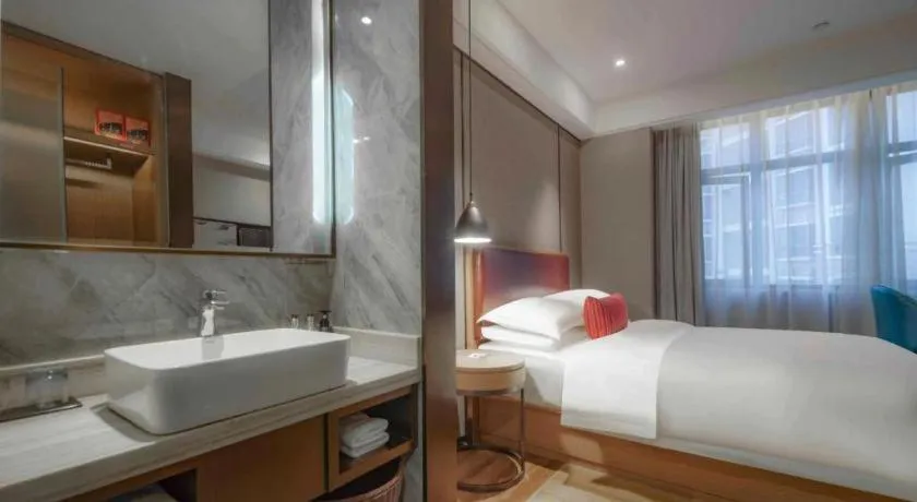 Bed in Borrman Hotel Liuzhou Guizhong Avenue Liugao