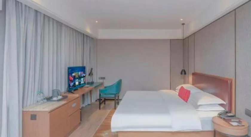 Bed in Borrman Hotel Liuzhou Guizhong Avenue Liugao