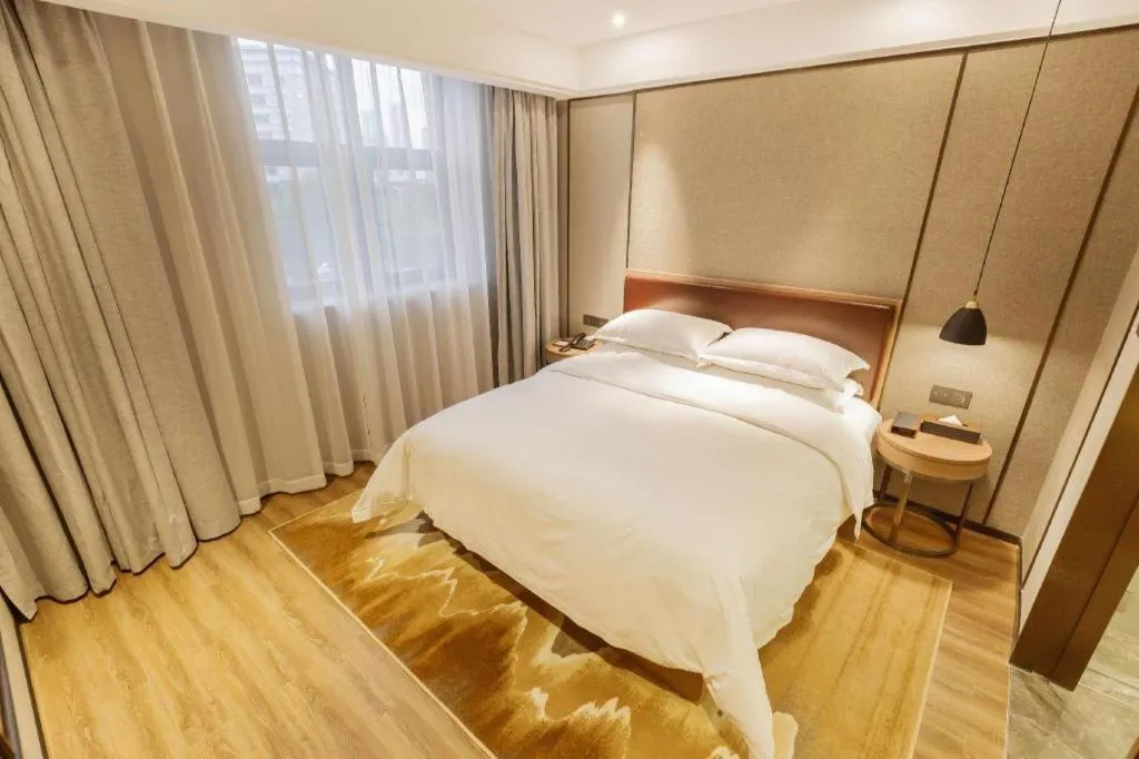 Bed in Borrman Hotel Liuzhou Guizhong Avenue Liugao