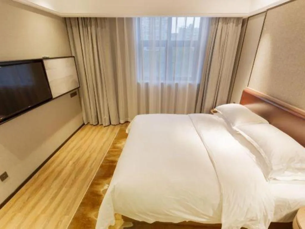 Bed in Borrman Hotel Liuzhou Guizhong Avenue Liugao