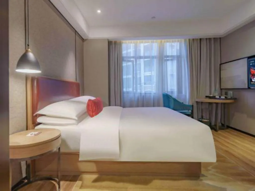 Bed in Borrman Hotel Liuzhou Guizhong Avenue Liugao