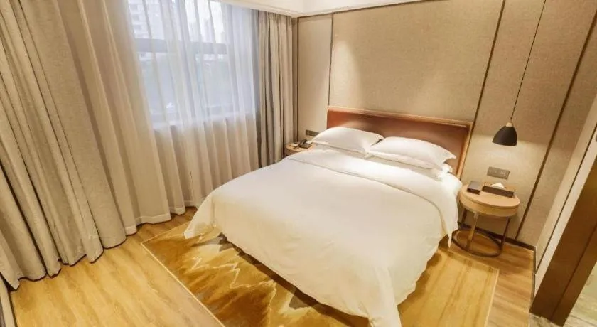 Bed in Borrman Hotel Liuzhou Guizhong Avenue Liugao