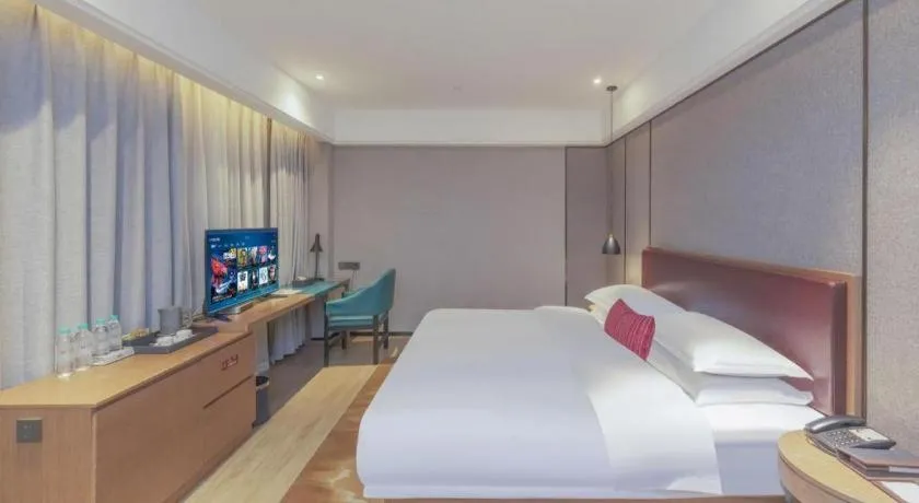 Bed in Borrman Hotel Liuzhou Guizhong Avenue Liugao