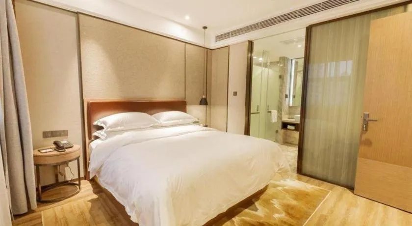 Bed in Borrman Hotel Liuzhou Guizhong Avenue Liugao
