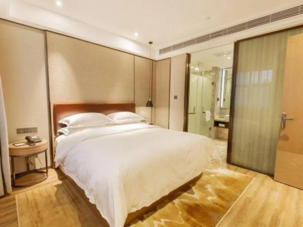 Bed in Borrman Hotel Liuzhou Guizhong Avenue Liugao