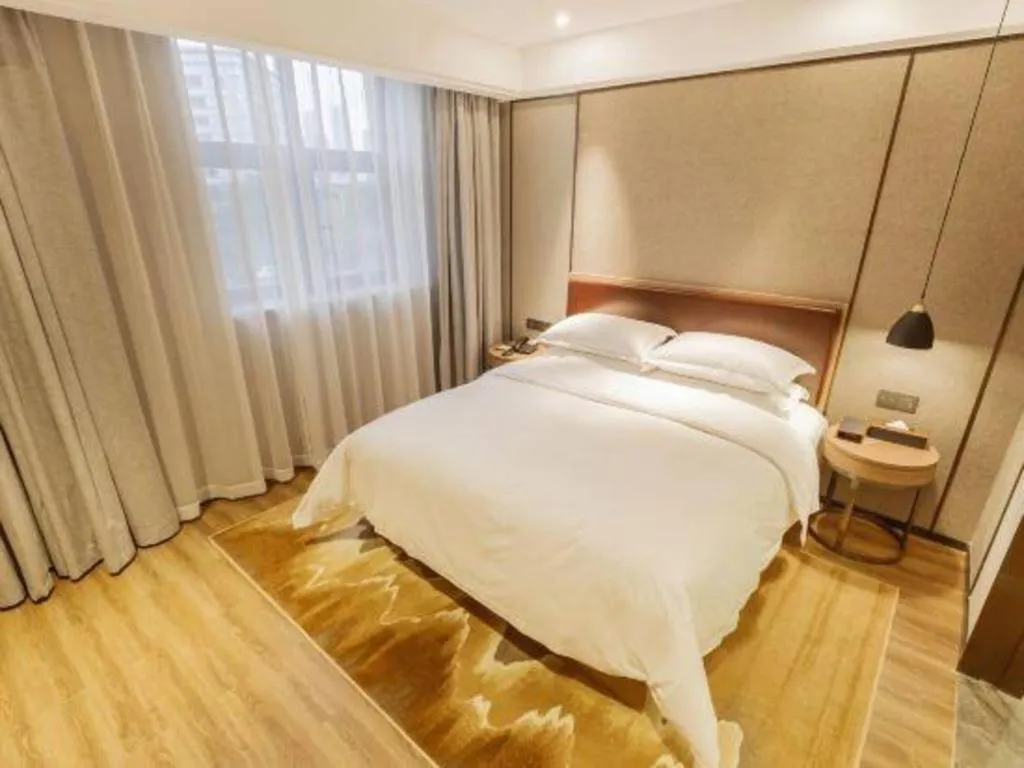 Bed in Borrman Hotel Liuzhou Guizhong Avenue Liugao