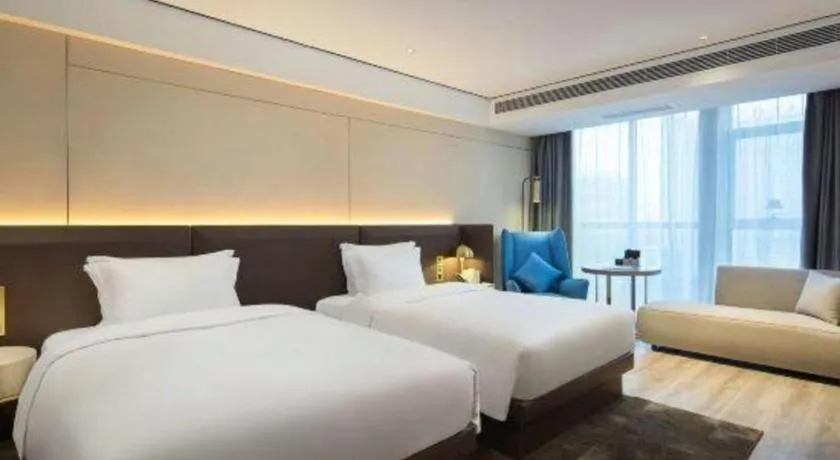 Bed in Echarm Plus Hotel Changsha High-speed Railway South Station Desiqin