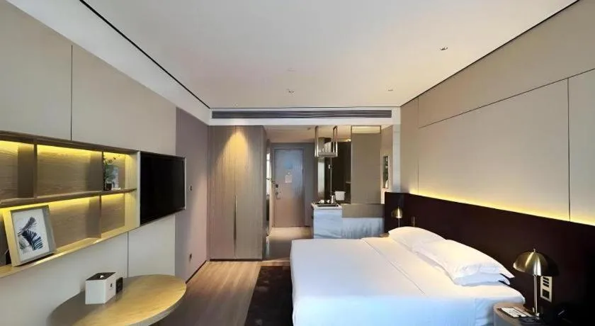 Bed in Echarm Plus Hotel Changsha High-speed Railway South Station Desiqin