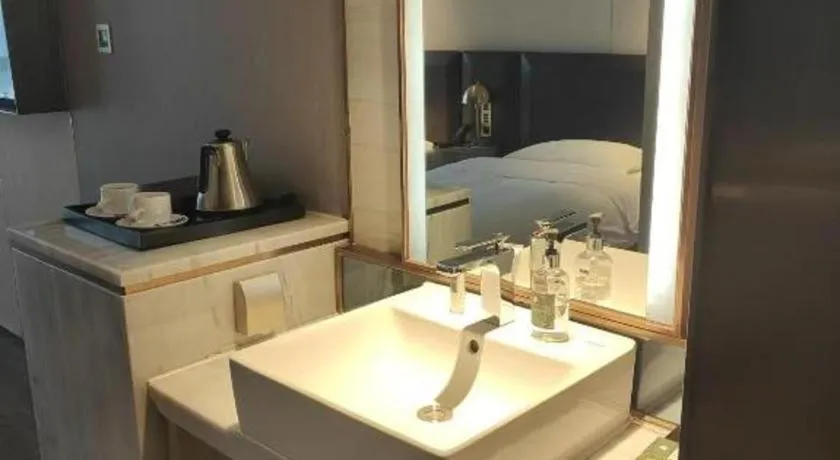 Bed in Echarm Plus Hotel Changsha High-speed Railway South Station Desiqin