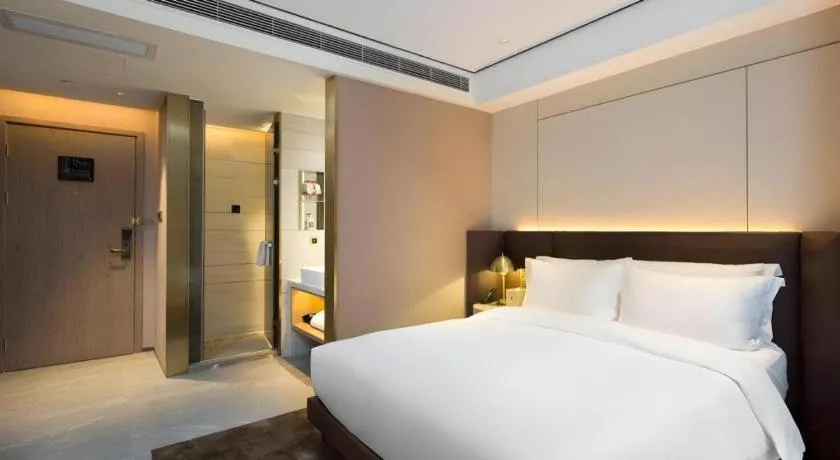 Bed in Echarm Plus Hotel Changsha High-speed Railway South Station Desiqin