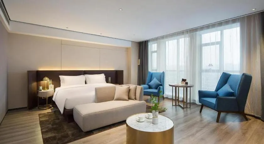 Bed in Echarm Plus Hotel Changsha High-speed Railway South Station Desiqin