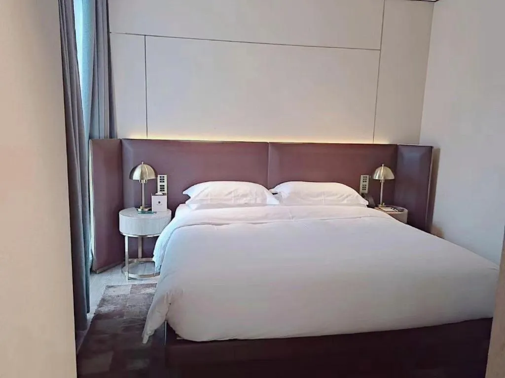 Bed in Echarm Plus Hotel Changsha High-speed Railway South Station Desiqin