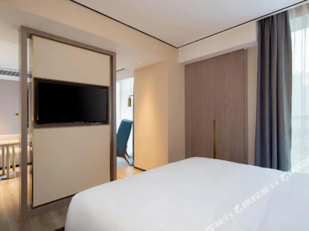 Bed in Echarm Plus Hotel Changsha High-speed Railway South Station Desiqin
