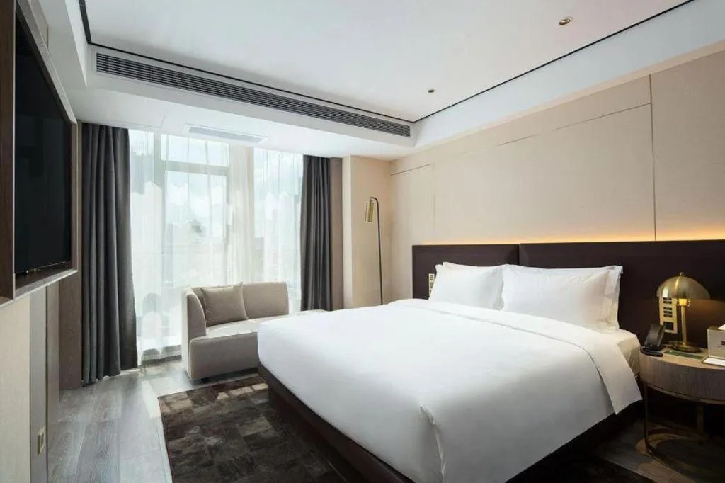 Bed in Echarm Plus Hotel Changsha High-speed Railway South Station Desiqin