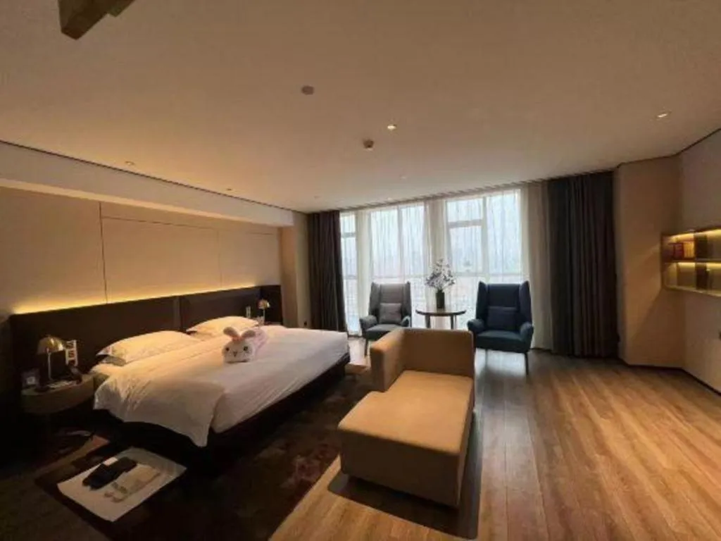 Bed in Echarm Plus Hotel Changsha High-speed Railway South Station Desiqin